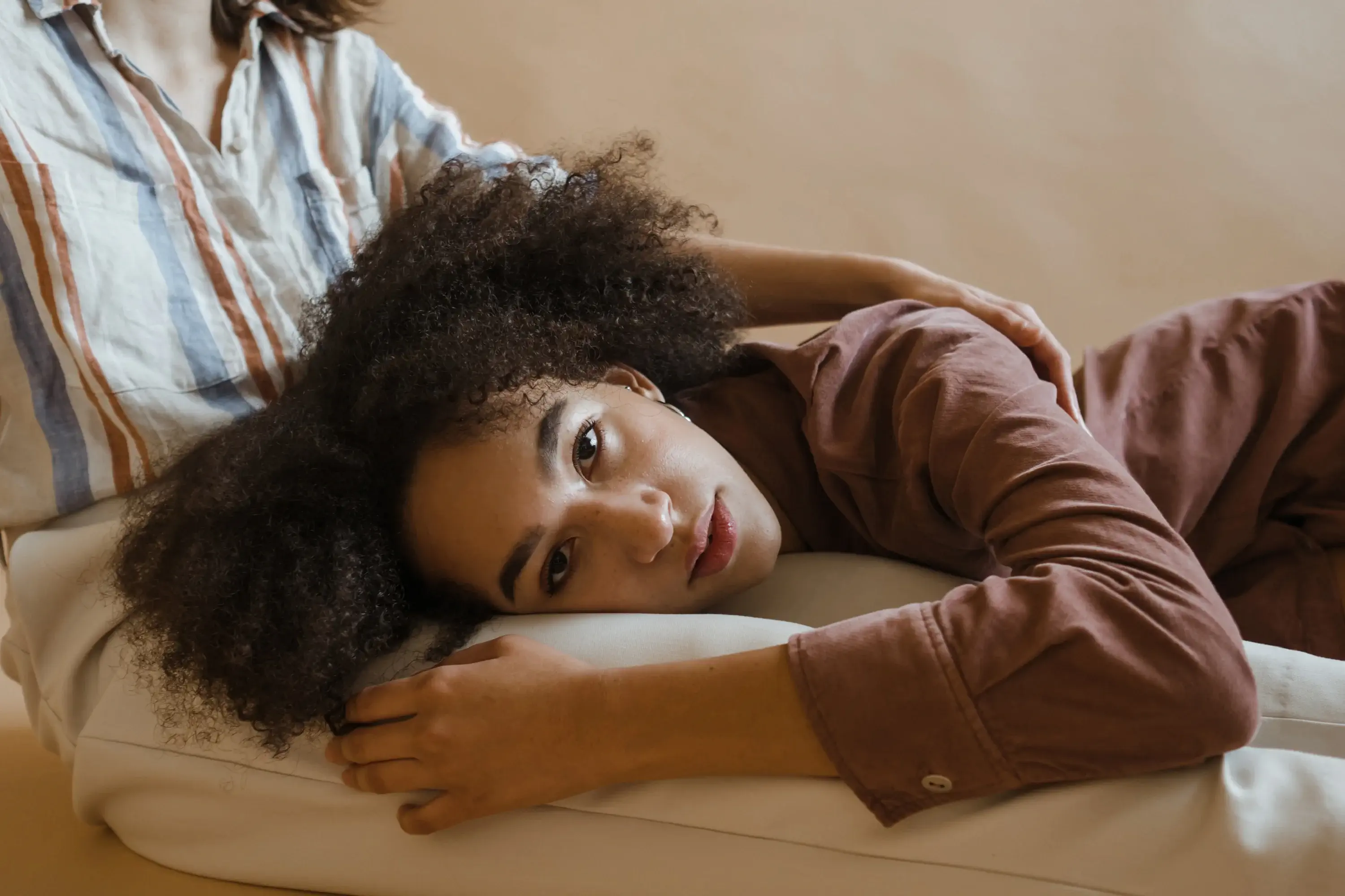 person lying next to another person relaxing